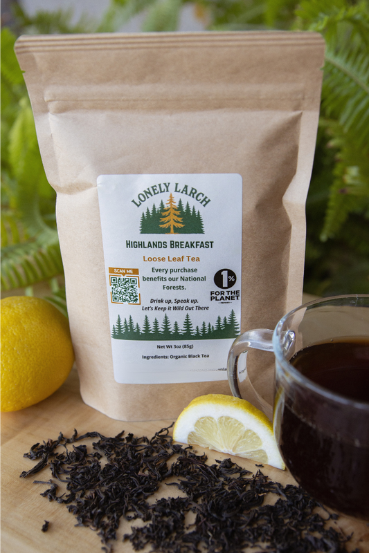Tea package with a cup of tea and lemon slices on a wooden surface